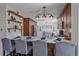 Eat-in kitchen with stainless steel appliances, open shelving, and sleek countertops at 10240 Travertine Pl, Parker, CO 80134