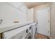 Bright laundry room with updated appliances and countertop space for folding at 10240 Travertine Pl, Parker, CO 80134