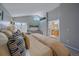 Beautiful, open bedroom with vaulted ceilings and ensuite bathroom access at 10240 Travertine Pl, Parker, CO 80134