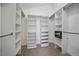 Organized walk-in closet with custom shelving and ample storage for any wardrobe at 10240 Travertine Pl, Parker, CO 80134