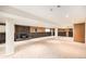 Finished basement featuring a brick fireplace and carpet flooring at 2043 S Salida St, Aurora, CO 80013