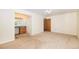 Comfortable bedroom with an attached vanity area, closet, and neutral carpet at 2043 S Salida St, Aurora, CO 80013