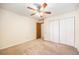 Bedroom featuring a ceiling fan, and a closet with doors at 2043 S Salida St, Aurora, CO 80013