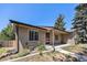 Charming single-story home with a well-maintained front yard and a classic brick facade at 2043 S Salida St, Aurora, CO 80013