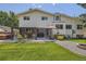 Expansive backyard with patio, hot tub, and lush green lawn, perfect for outdoor entertaining at 1011 S Holland Ct, Lakewood, CO 80226