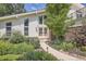 Charming home with well-maintained landscaping and inviting front entrance at 1011 S Holland Ct, Lakewood, CO 80226