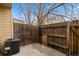 Cozy patio area featuring a privacy fence and air conditioning unit at 1671 S Idalia Cir # D, Aurora, CO 80017