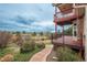 Landscaped backyard featuring a two-level deck with beautiful views of the golf course at 7965 S Eudora Cir, Centennial, CO 80122