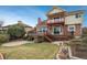 Stunning backyard with multi-level deck, patio, and lush landscaping at 7965 S Eudora Cir, Centennial, CO 80122