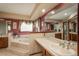 Spacious bathroom with a soaking tub, large vanity, and ample natural light at 7965 S Eudora Cir, Centennial, CO 80122