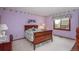 Charming bedroom with decorative wall trim, floral accents, and a cozy atmosphere at 7965 S Eudora Cir, Centennial, CO 80122