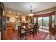 Eat-in kitchen area featuring hardwood floors, a breakfast table, and access to an outdoor deck at 7965 S Eudora Cir, Centennial, CO 80122