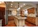 Spacious kitchen featuring custom cabinets, granite countertops, and hardwood floors at 7965 S Eudora Cir, Centennial, CO 80122