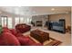 Spacious living room with stone fireplace and comfortable seating at 7965 S Eudora Cir, Centennial, CO 80122