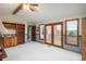 Bright, open living room with vaulted ceilings, wood trim and an attached deck at 7965 S Eudora Cir, Centennial, CO 80122