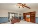 Bright home office with built in bookshelves, desk area and blue-toned walls at 7965 S Eudora Cir, Centennial, CO 80122
