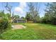 View of the backyard with green space and fence that surrounds the entire property at 1941 Alton St, Aurora, CO 80010