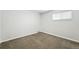 Neutral bedroom featuring neutral carpet and a sun-filled window at 1941 Alton St, Aurora, CO 80010