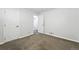 Bedroom featuring neutral carpet and multiple closets for ample storage solutions at 1941 Alton St, Aurora, CO 80010