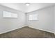 Cozy bedroom featuring neutral carpet, natural light, and a modern ceiling fixture at 1941 Alton St, Aurora, CO 80010
