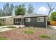 Attractive home with a well-maintained front yard, an appealing covered porch, and simple, neat landscaping at 1941 Alton St, Aurora, CO 80010