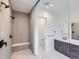 Elegant bathroom featuring a tiled shower and sleek vanity at 454 Basin Daisy St, Castle Rock, CO 80104