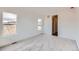 Bright bedroom with neutral carpet and windows for ample natural light at 454 Basin Daisy St, Castle Rock, CO 80104