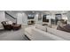Finished basement offering a living area, bar area, and stylish furnishings; a perfect entertainment space at 3092 Fox Sedge Pl, Highlands Ranch, CO 80126