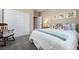 Cozy bedroom with a comfortable bed, rocking chair, closet, and soft natural light from the window at 3092 Fox Sedge Pl, Highlands Ranch, CO 80126