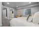 Comfortable bedroom featuring stylish furnishings and access to an en-suite bathroom at 3092 Fox Sedge Pl, Highlands Ranch, CO 80126