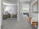Upstairs hallway showcasing access to an office and a view into the open-concept living area at 3092 Fox Sedge Pl, Highlands Ranch, CO 80126