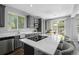 Well-appointed kitchen with an island, stainless steel appliances, and ample counter space at 3092 Fox Sedge Pl, Highlands Ranch, CO 80126