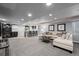 Open-concept space with seating, wine rack, and stylish wet bar at 3092 Fox Sedge Pl, Highlands Ranch, CO 80126