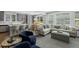 Living room with plush seating opening into the dining and kitchen areas at 3092 Fox Sedge Pl, Highlands Ranch, CO 80126