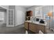 Spacious office with sliding door and bookshelf for storage and organization, and a calming view at 3092 Fox Sedge Pl, Highlands Ranch, CO 80126