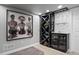 Modern wine storage with custom rack and shelving, enhanced by contemporary artwork at 3092 Fox Sedge Pl, Highlands Ranch, CO 80126