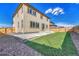 Expansive backyard with concrete patio and artificial turf, perfect for outdoor entertaining and relaxation at 15902 Stringhalt Way, Parker, CO 80134