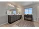 Beautiful bathroom with double vanity, large mirror, and ample counter space at 15902 Stringhalt Way, Parker, CO 80134