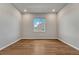 Bedroom with wood floors, neutral walls, recessed lighting, and window providing natural light at 15902 Stringhalt Way, Parker, CO 80134