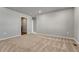 Bonus room with neutral carpet and walls, featuring two doorways leading to other rooms at 15902 Stringhalt Way, Parker, CO 80134