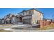 Charming home with a two-car garage, appealing curb appeal, and a welcoming entrance at 15902 Stringhalt Way, Parker, CO 80134