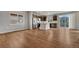 A modern kitchen with dark cabinets, stainless steel appliances and a center island with bar seating at 15902 Stringhalt Way, Parker, CO 80134