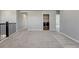 Upstairs landing and convenient laundry room with washer and dryer hookups and neutral carpeting at 15902 Stringhalt Way, Parker, CO 80134