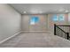 Comfortable living room with staircase and natural light shining through the windows at 15902 Stringhalt Way, Parker, CO 80134