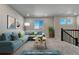 Loft area with plush carpeting, ample natural light, and stylish staged furnishings at 15902 Stringhalt Way, Parker, CO 80134