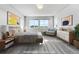 Staged main bedroom with plush carpeting, neutral walls, and ample natural light from multiple windows at 15902 Stringhalt Way, Parker, CO 80134