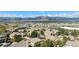 Aerial view of neighborhood featuring mature trees and mountain views at 1660 Moveen Hts, Monument, CO 80132