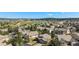 Expansive aerial view of a desirable community with mature trees and a serene lake at 1660 Moveen Hts, Monument, CO 80132