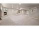 Spacious finished basement features a fireplace, neutral carpet, and potential for various uses at 1660 Moveen Hts, Monument, CO 80132