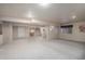 Finished basement area featuring neutral carpet, wet bar area, and potential for various uses at 1660 Moveen Hts, Monument, CO 80132